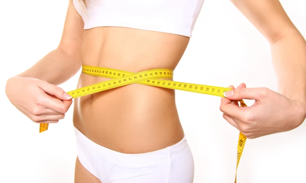 Woman measuring waist for Weight Loss Programs in Linwood, NJ